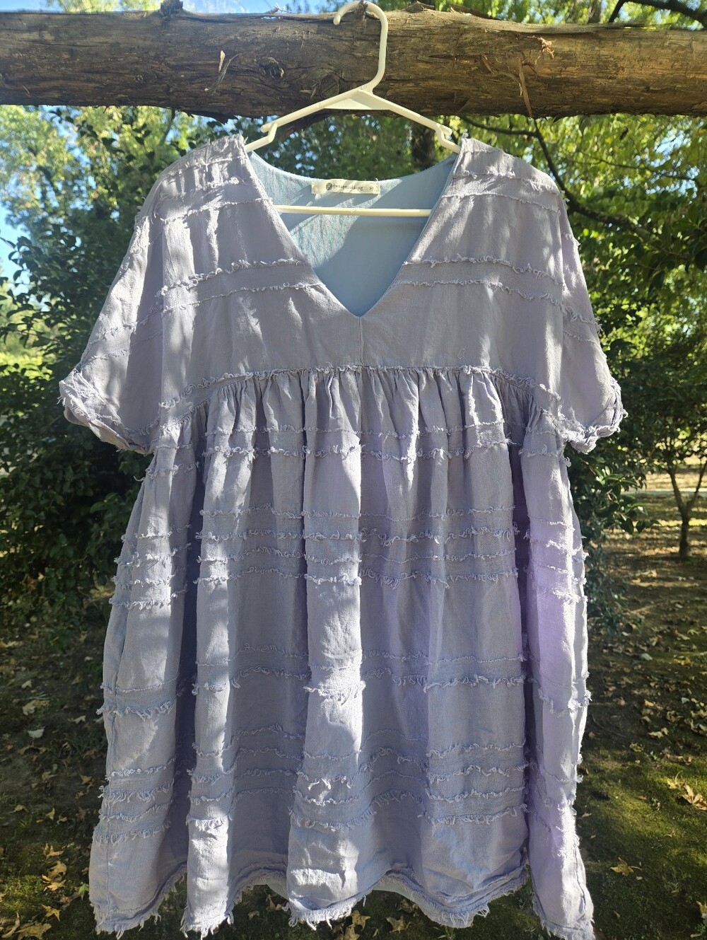 Periwinkle blue babydoll mini dress from the boutique brand The Impeccable Pig.